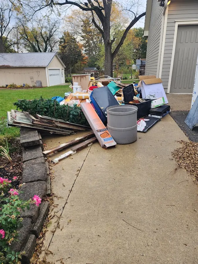 Dumpster being loaded with debris for 10 Yard Dumpster Rental in Onalaska